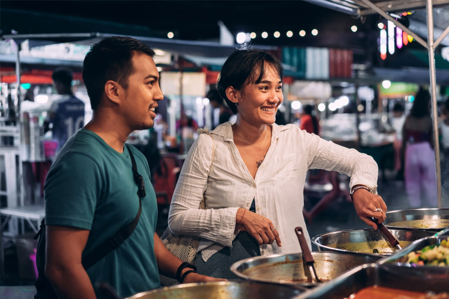 Food Photography in SG: Customer purchasing food from a local vendor stall